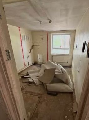 Before: room with fittings and waste left behind